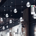 Aigostar - Cadena de luces LED navideña para exterior 120 LED/8 funciones 3x0,6m IP44 blanco frío + mando a distancia