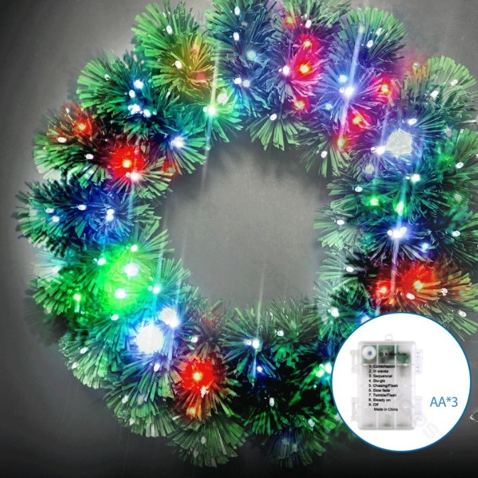 Aigostar - Corona navideña exterior LED RGBY, 72 LEDs, 3 pilas AA, diámetro 50 cm, IP44