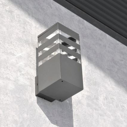 Aplique de pared exterior LED RGBW regulable TEKSAS 1xE27/12W/230V 2700-6500K Wi-Fi IP44 antracita