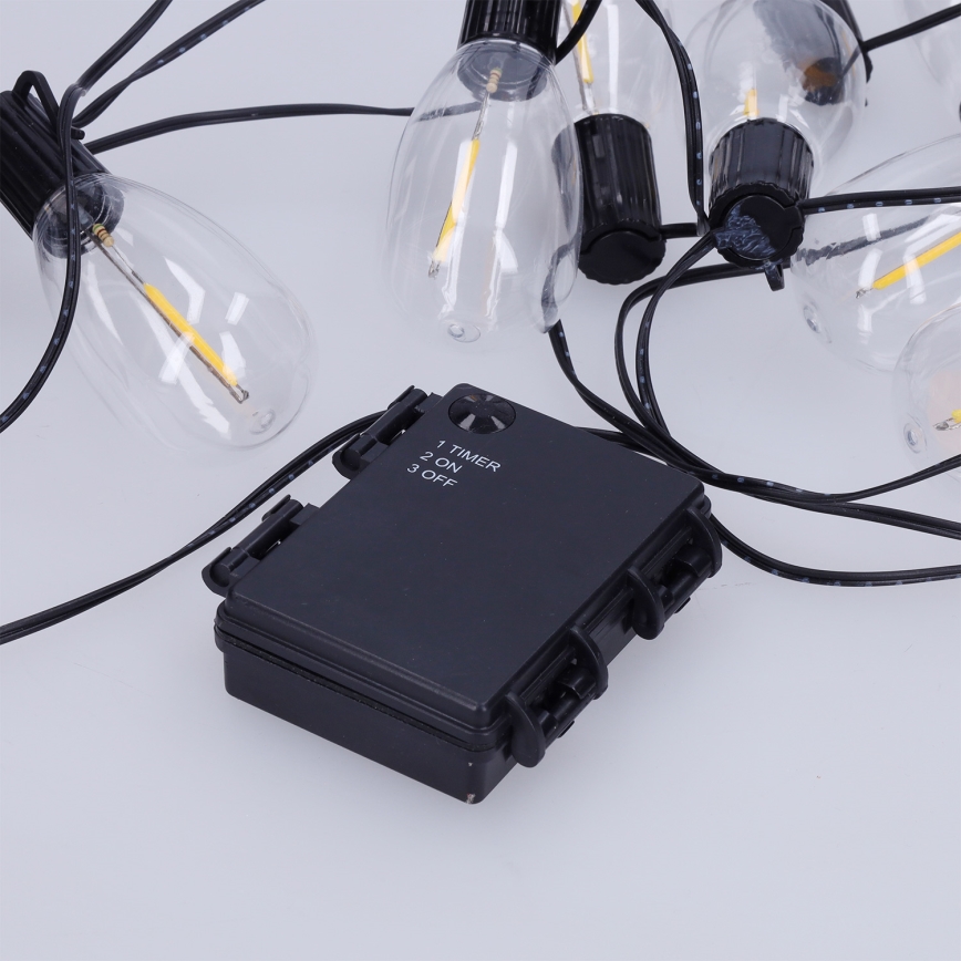 Brilagi - Guirnalda LED para exteriores, 10 LEDs / 3x AA, 3,2 m, IP44, blanco cálido