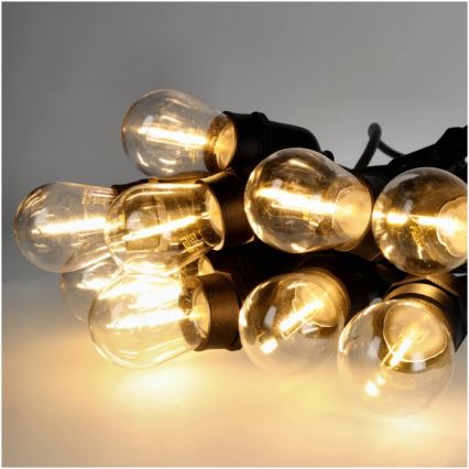Cadena decorativa LED para exteriores BAJA ST64 20xE27/1W/230V 20,9m IP44 blanco cálido