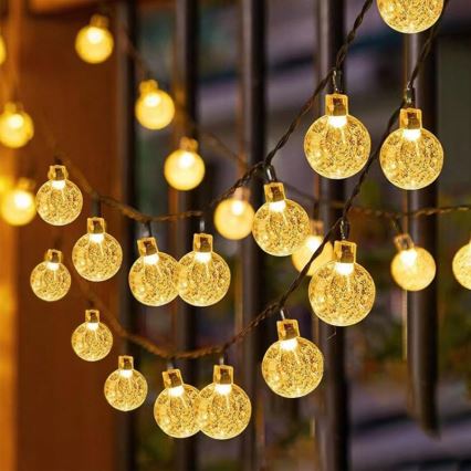 Guirnalda solar decorativa LED, 50 LEDs / 8 funciones, 500 mAh, 9,5 m, IP67, blanco cálido