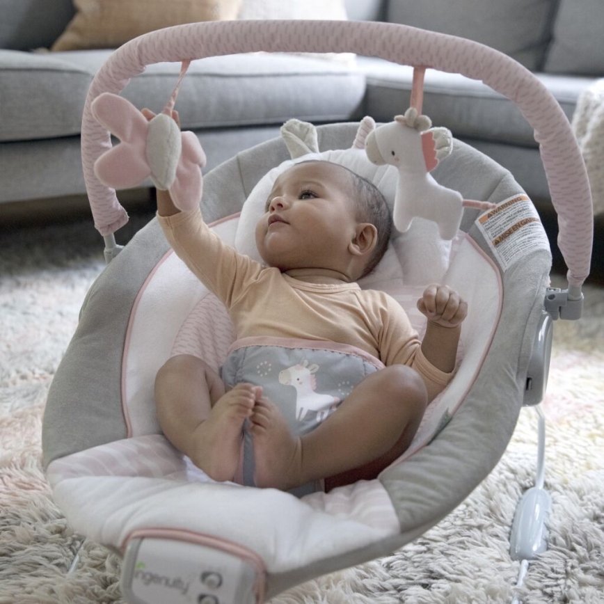 Ingenuity - Tumbona vibradora para bebés con melodía FLORA THE UNICORN 3xC