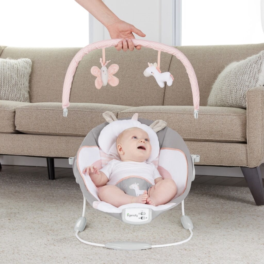 Ingenuity - Tumbona vibradora para bebés con melodía FLORA THE UNICORN 3xC