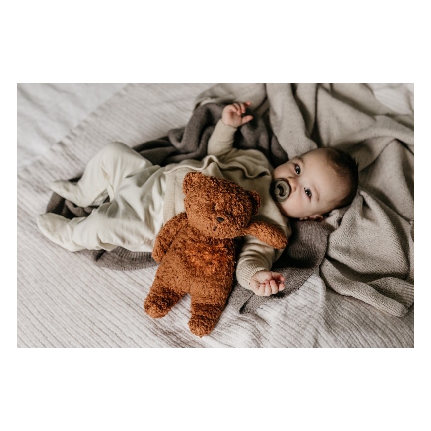 Moonie - Pelele con melodía y luz, pequeño oso de miel orgánica en tono caramelo natural