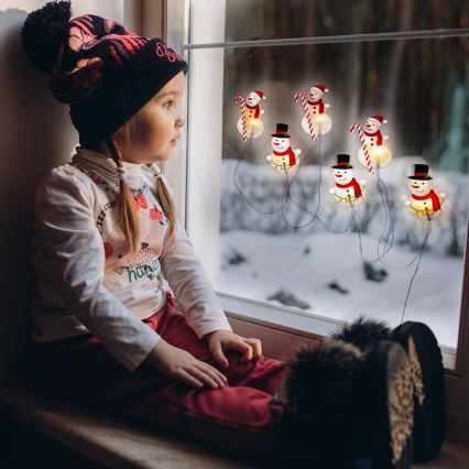 Guirnalda LED con ventosas, 6xLED/2xAA, 1,2 m, blanco cálido — muñeco de nieve